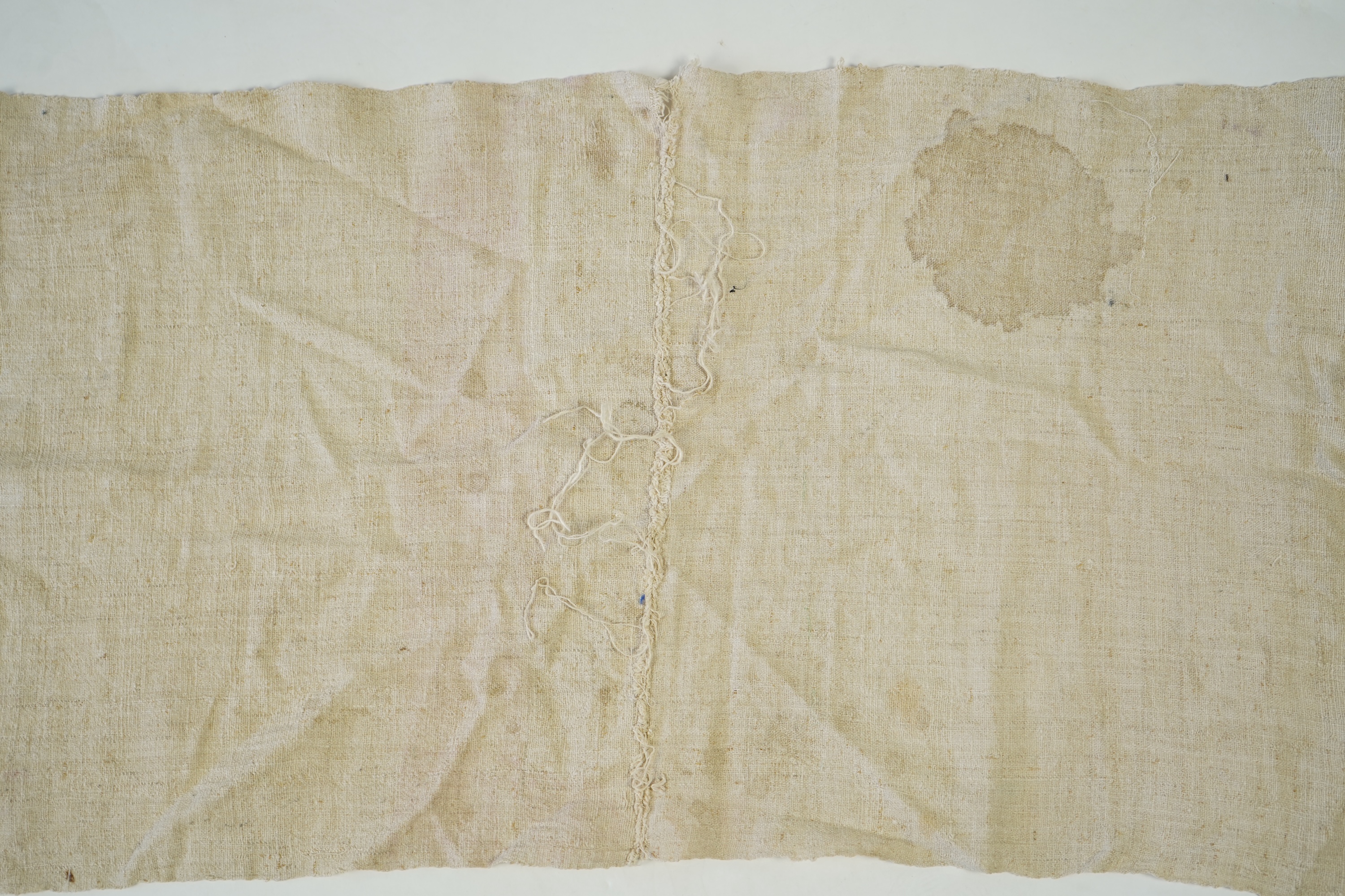 An early 20th century heavy hand woven linen Turkish towel, with coloured silk embroidered ends. 123cm long x 43cm wide. Condition - has two stains and some embroidery worn in places.